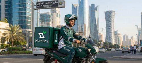 NutriBox delivery rider handing over a parcel
